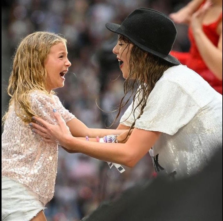 Watch the Sweet Moment Taylor Swift Gives a Young Girl a “22” Hat During The Eras Tour
